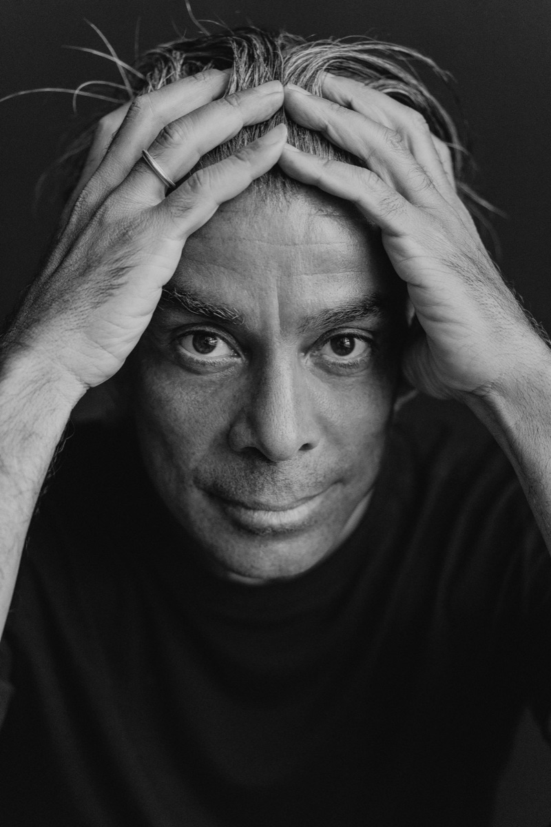 Walid Arfush — studio portrait, hands to head