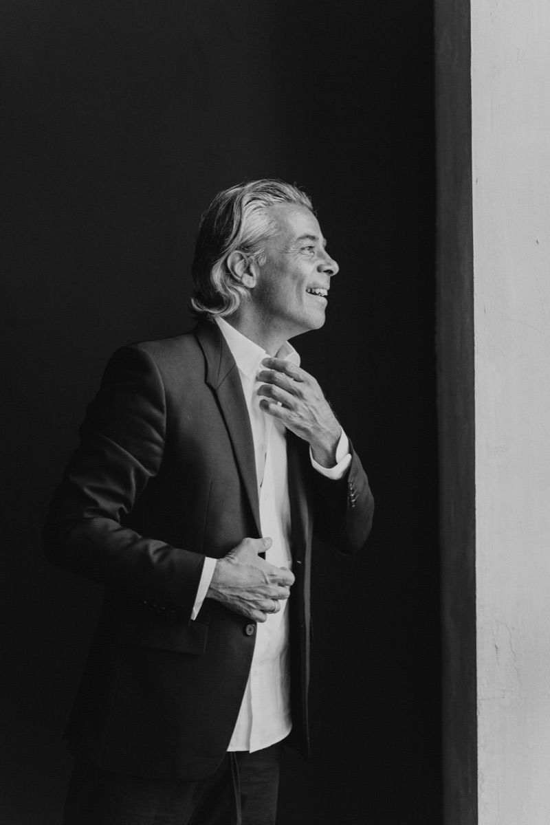 Walid Arfush — studio portrait in a suit, profile